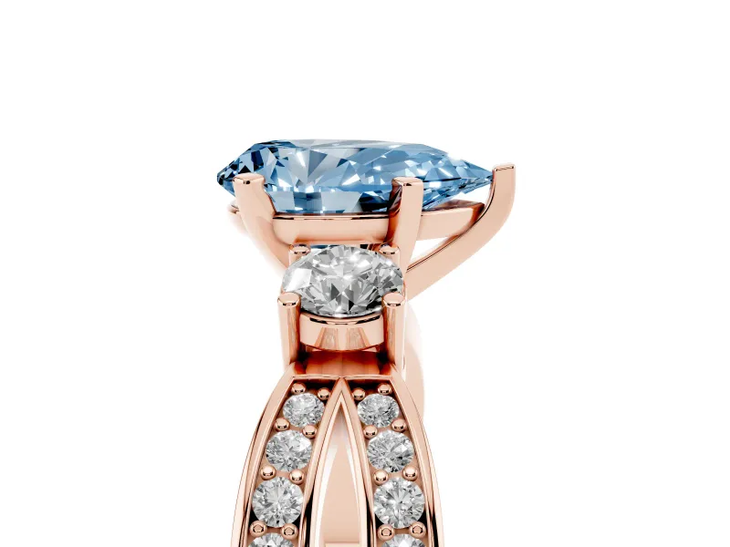 Fancy Blue Three-Stone Pear Cut Diamond Twist Band Ring Set in Rose gold with Pavé Accents and Prong Setting