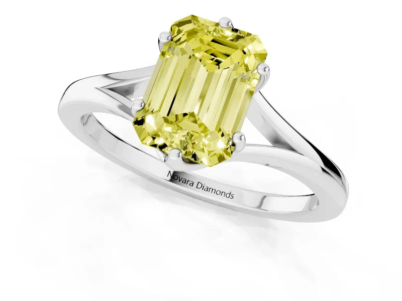 Fancy Yellow Emerald Cut Diamond Solitaire Ring Set in Platinum with Polished Tapered Band and Prong Setting