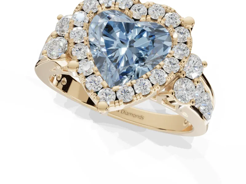 Heart-Shaped Halo Engagement Ring Setting for a Fancy Blue Lab-Grown Diamond | Graduated Channel Band | Yellow Gold