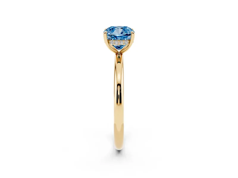 Fancy Blue Cushion Cut Diamond Solitaire Ring Set in Yellow gold with Thin Band and Prong Setting