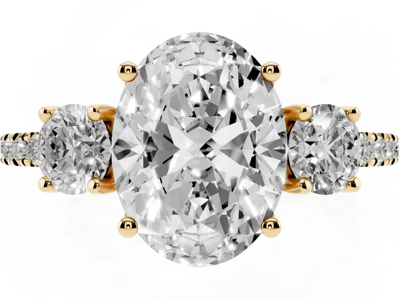Oval Cut Diamond Three-Stone Ring Set in Yellow gold with Pavé Band and Graduated Sides