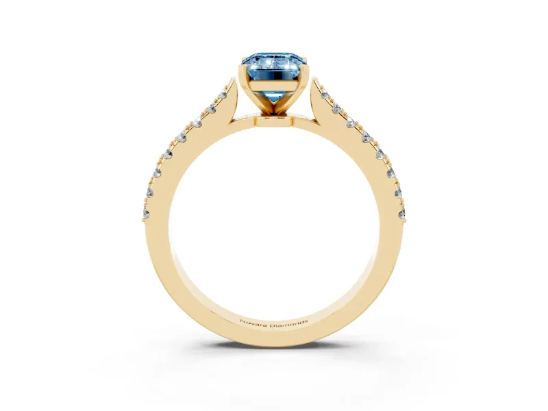 Fancy Blue Emerald Cut Diamond Solitaire Engagement Ring Set in Yellow gold with Delicate Pavé Band and Prong Setting