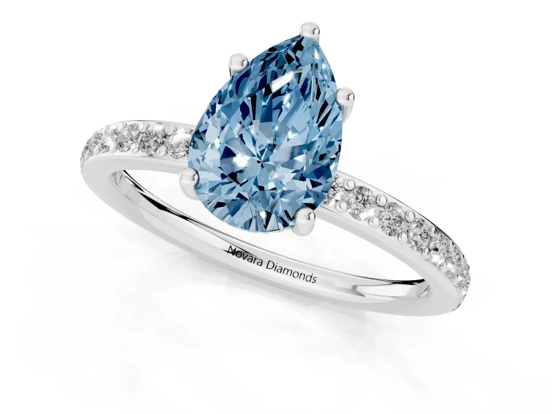 Fancy Blue Pear Cut Diamond Pavé Band Ring Set in White gold with Prong-Set Center Stone