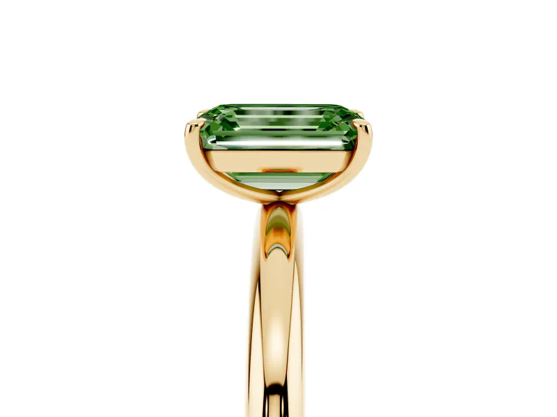 Fancy Green Emerald Cut Diamond Solitaire Ring Set in Yellow gold with Prong Setting on a Polished Plain Band