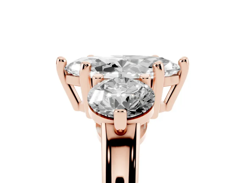 Marquise Cut Diamond Three-Stone Ring Set in Rose gold with Prong Setting and Classic Band