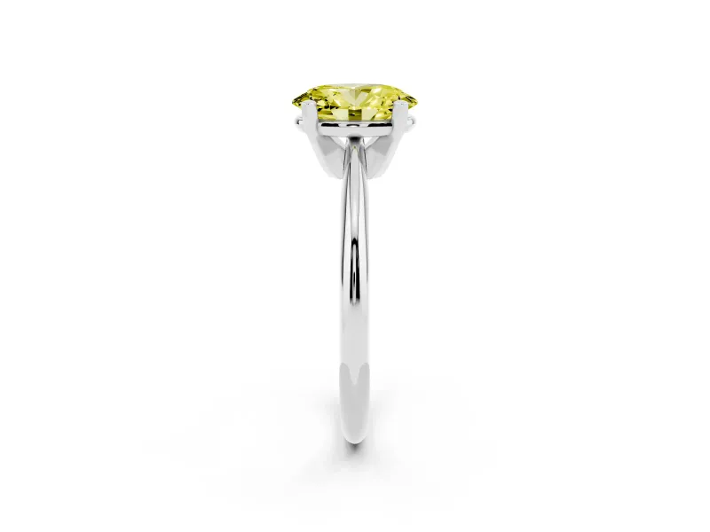 Fancy Yellow Oval Cut Diamond Solitaire Ring Set in Silver with Prong Setting on a Plain Round Band