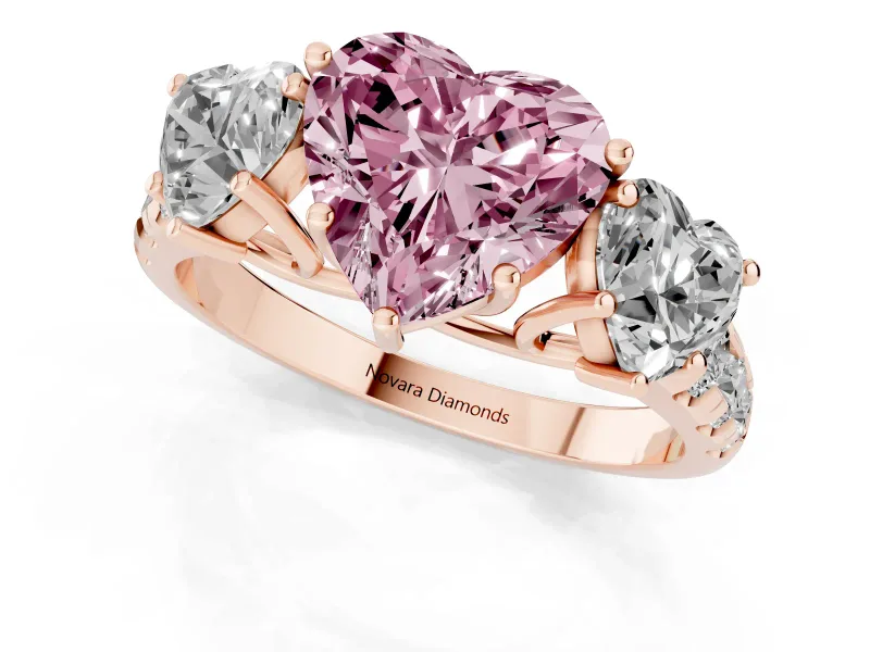 Fancy Pink Heart Cut Diamond Three-Stone Ring Set in Rose gold with Pavé Band