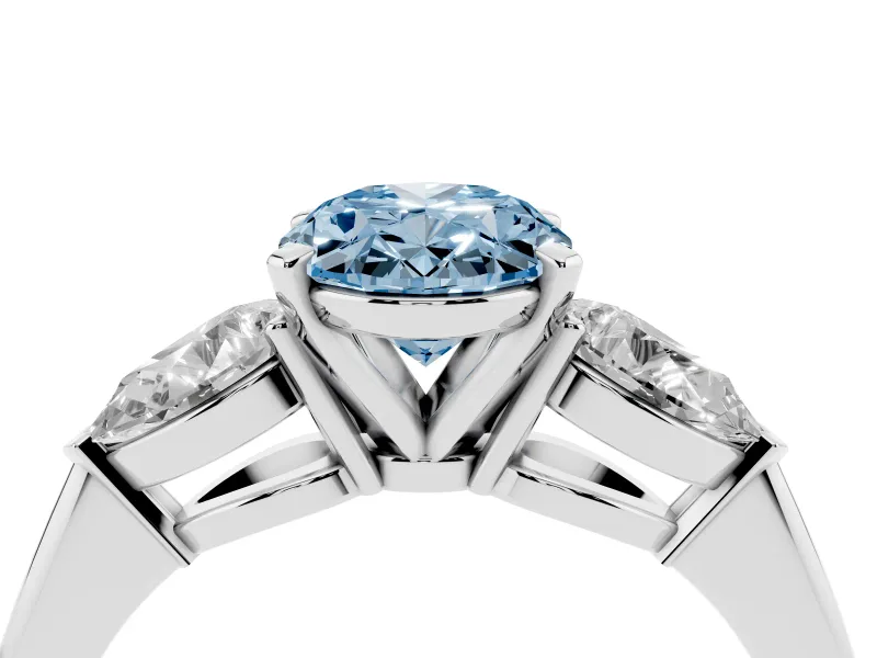 Fancy Blue Three-Stone Oval Cut Diamond Ring Set in Silver with Pear Side Stones and Prong Setting