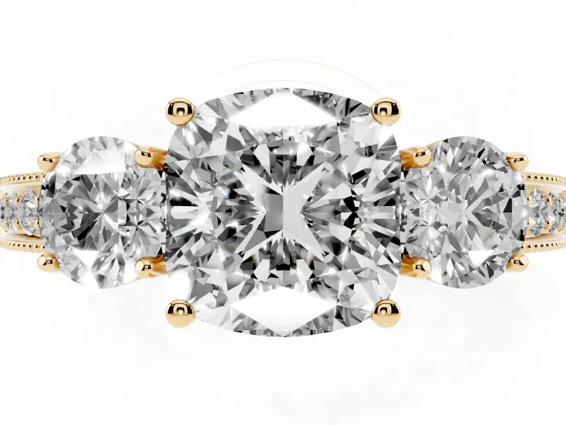 Cushion Cut Diamond Three-Stone Ring Set in Yellow gold with Round Side Stones and Pavé Band