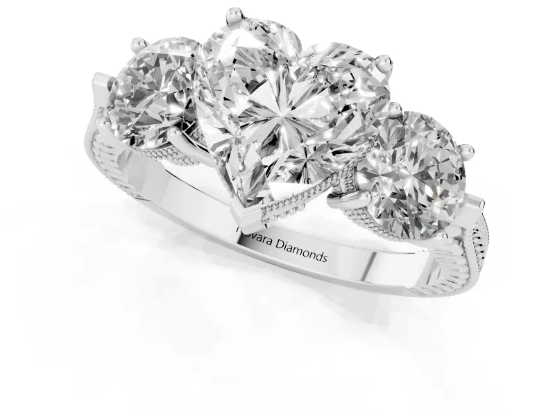 Heart Cut Diamond Three-Stone Ring Set in Platinum with Milgrain Band