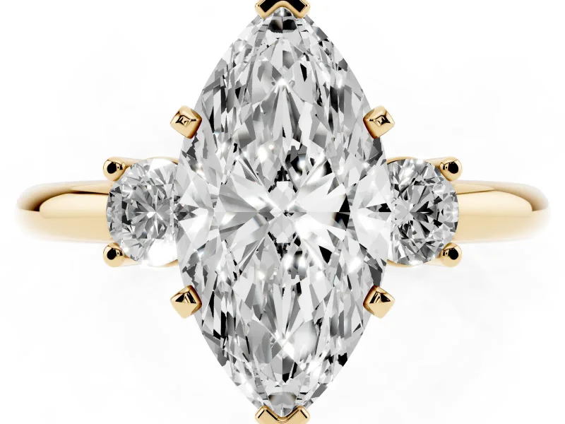 Three-Stone Marquise Cut Diamond Ring Set in Yellow gold with Prong Setting and Plain Band