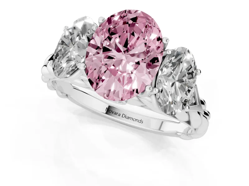 Fancy Pink Oval Cut Diamond Three-Stone Ring Set in Platinum with Braided Band