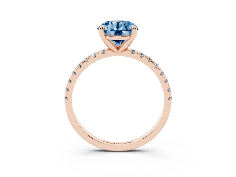 Fancy Blue Round Cut Diamond Brilliant Solitaire Ring Set in Rose gold with Pavé Band and Prong Setting