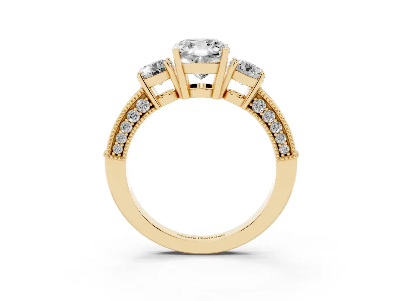 Cushion Cut Diamond Three-Stone Ring Set in Yellow gold with Round Side Stones and Pavé Band