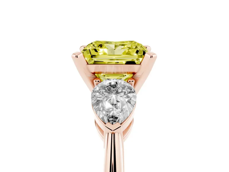 Fancy Yellow Three-Stone Princess Cut Diamond Ring Set in Rose gold with Pear Side Stones and Prong Setting