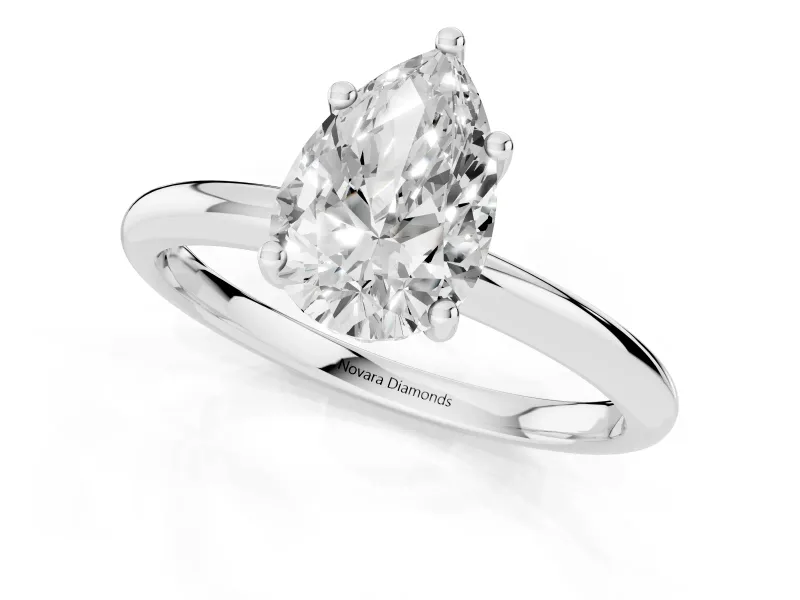 Pear Cut Diamond Solitaire Engagement Ring Set in Silver with Prong Setting and Polished Band