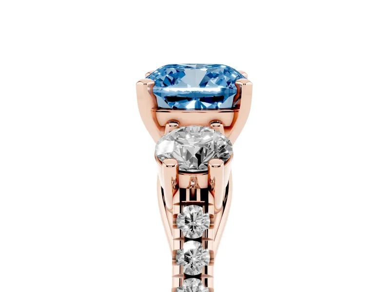 Fancy Blue Three-Stone Cushion Cut Diamond Pavé Band Ring Set in Rose gold with Prong-Set Trio