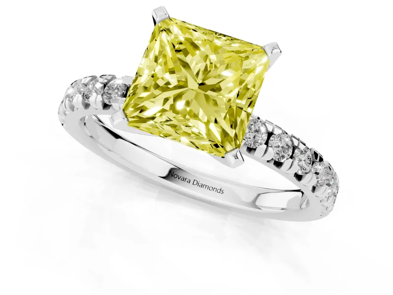 Fancy Yellow Princess Cut Diamond Solitaire Pavé Engagement Ring Set in White gold with Round Band and Prong Setting