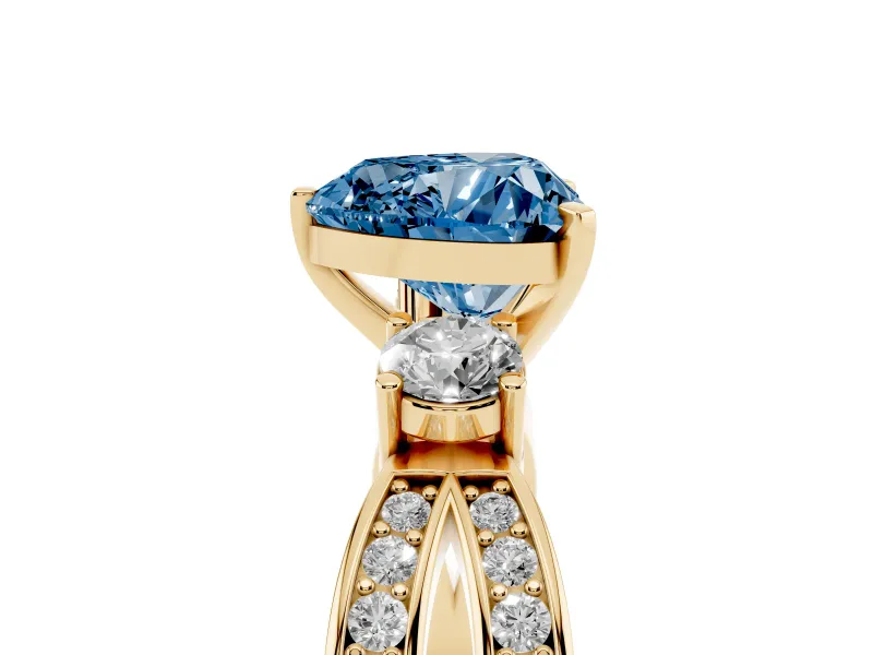 Fancy Blue Three-Stone Heart Cut Diamond Twist Band Ring Set in Yellow gold with Pavé Accents and Prong Setting