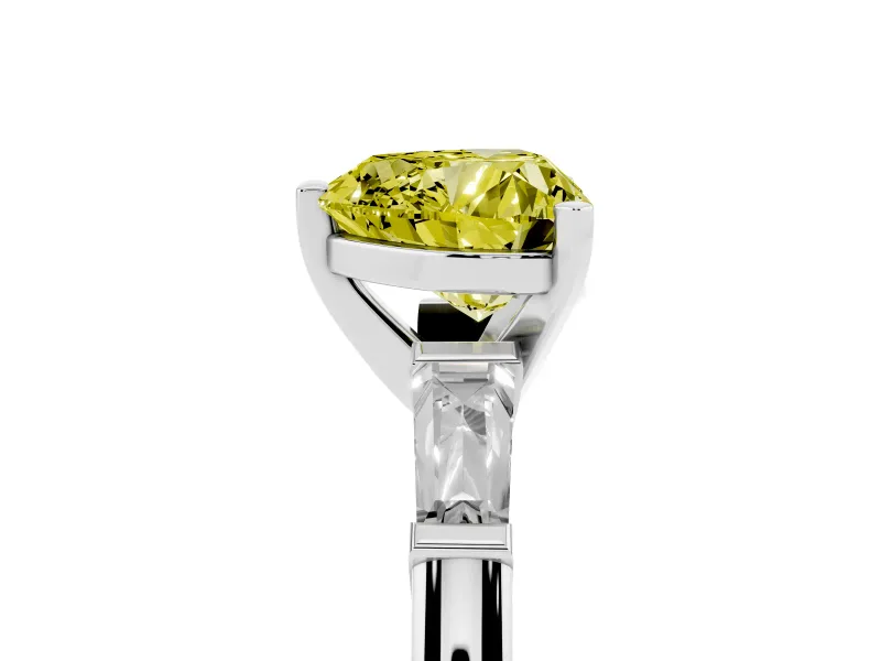 Fancy Yellow Heart Cut Diamond Solitaire Ring Set in Platinum with Tapered Baguette Side Stones and Prong Setting