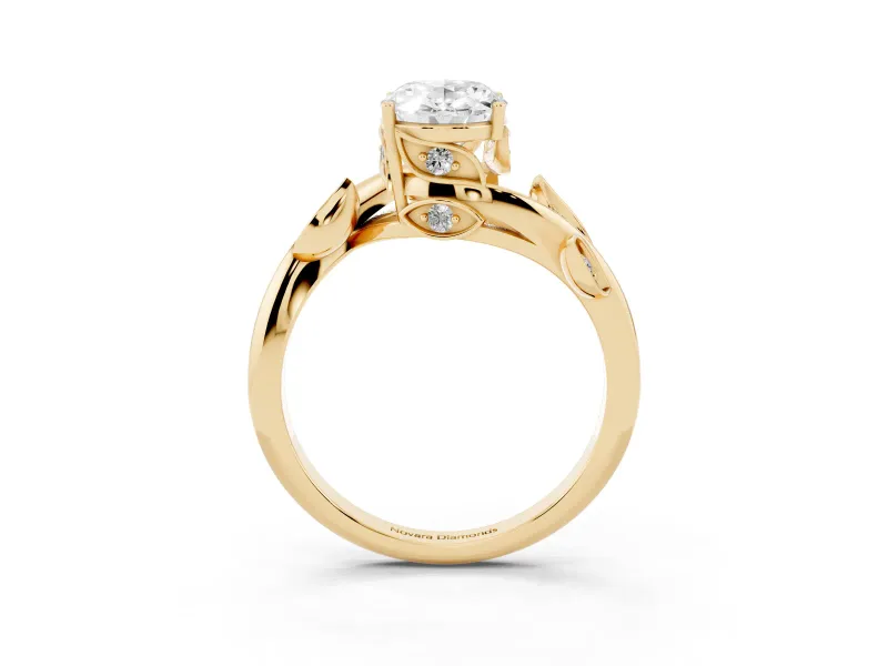Oval Cut Diamond Solitaire Twist Engagement Ring Set in Yellow gold with Pavé Leaf Accents