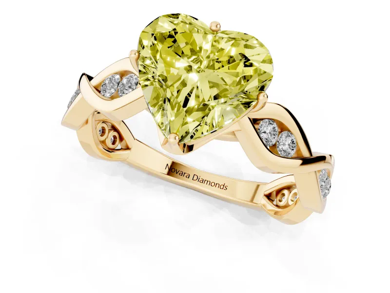 Fancy Yellow Heart Cut Diamond Twist Band Solitaire Ring Set in Yellow gold with Leaf Prong Setting and Accent Stones