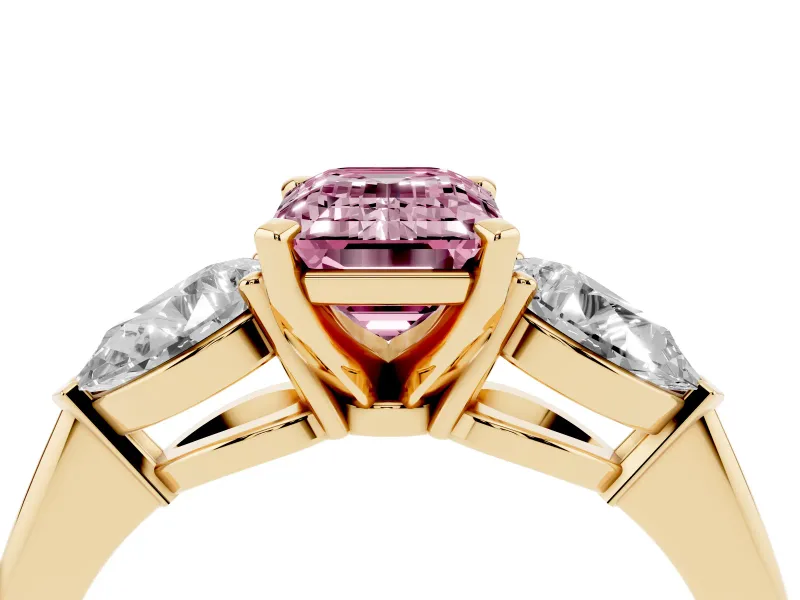 Fancy Pink Three-Stone Emerald Cut Diamond Ring Set in Yellow gold with Pear Side Stones and Prong Setting