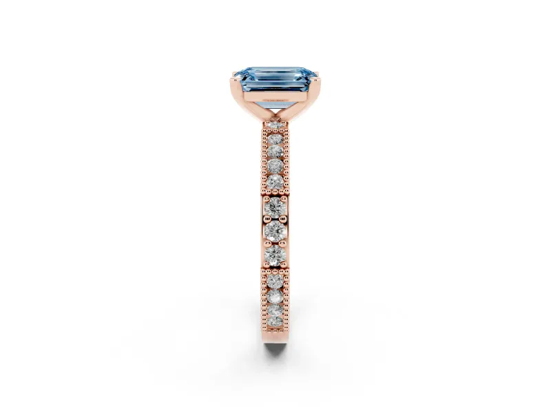 Fancy Blue Emerald Cut Diamond Solitaire Ring Set in Rose gold with Slim Pavé Band and Prong Setting