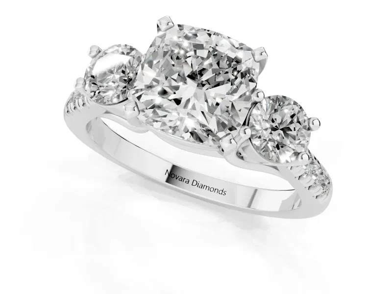 Three-Stone Cushion Cut Diamond Pavé Band Ring Set in White gold with Prong-Set Trio