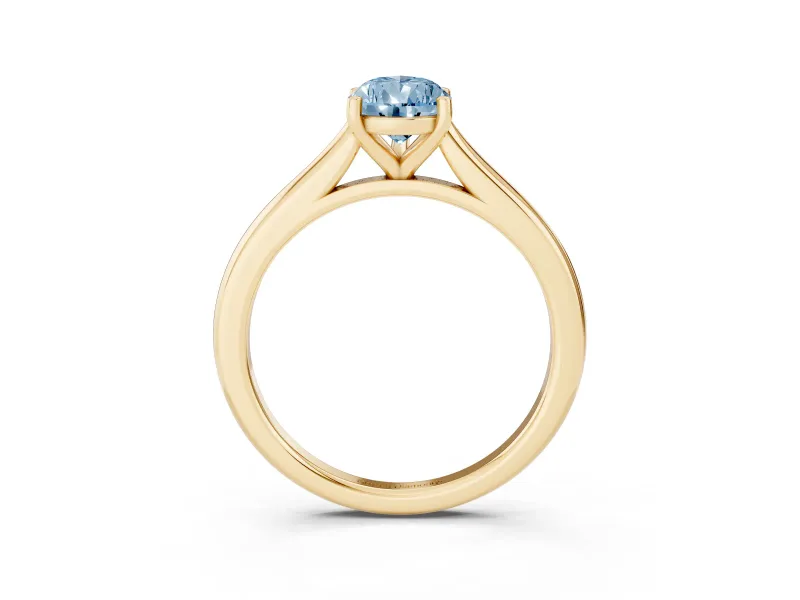 Fancy Blue Pear Cut Diamond Solitaire Ring Set in Yellow gold with Cathedral Band and Prong Setting