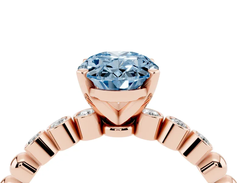 Fancy Blue Oval Cut Diamond Solitaire Engagement Ring Set in Rose gold with Bezel Accents on Beaded Band