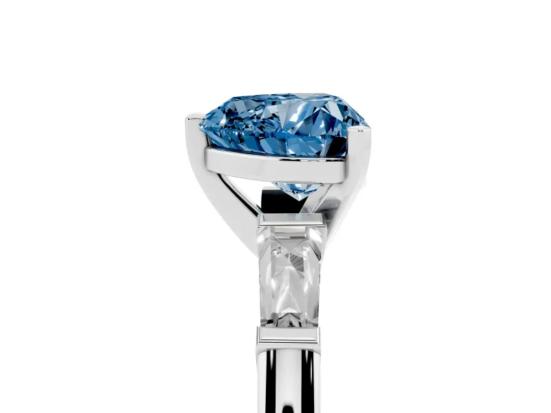 Fancy Blue Heart Cut Diamond Solitaire Ring Set in Silver with Tapered Baguette Side Stones and Prong Setting