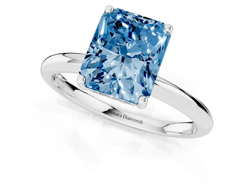 Fancy Blue Radiant Cut Diamond Solitaire Engagement Ring Set in Silver with Prong Setting and Polished Band