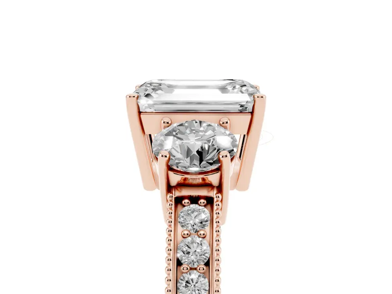 Emerald Cut Diamond Three-Stone Ring Set in Rose gold with Round Side Stones and Pavé Band