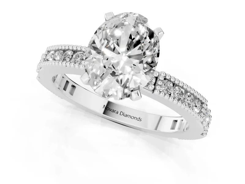 Oval Cut Diamond Solitaire Ring Set in Platinum with Slim Pavé Band and Prong Setting