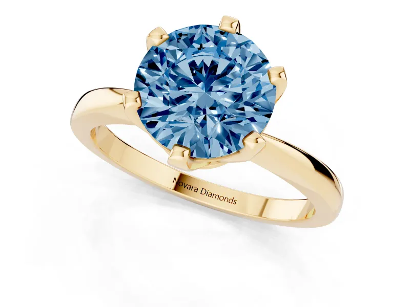 Fancy Blue Round Cut Diamond Solitaire Engagement Ring Set in Yellow gold with Slim Tapered Solitaire Band