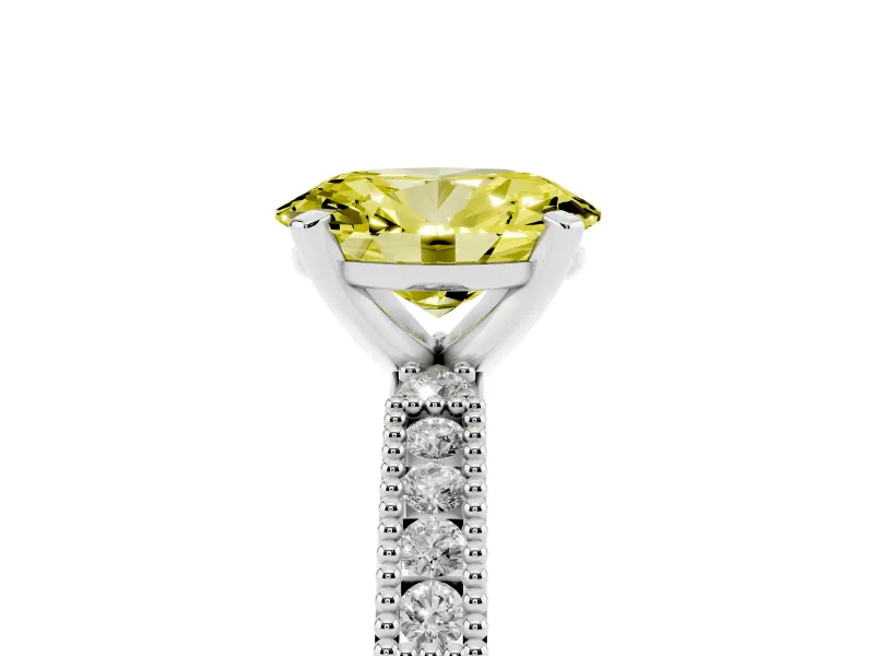 Fancy Yellow Oval Cut Diamond Solitaire Ring Set in White gold with Slim Pavé Band and Prong Setting