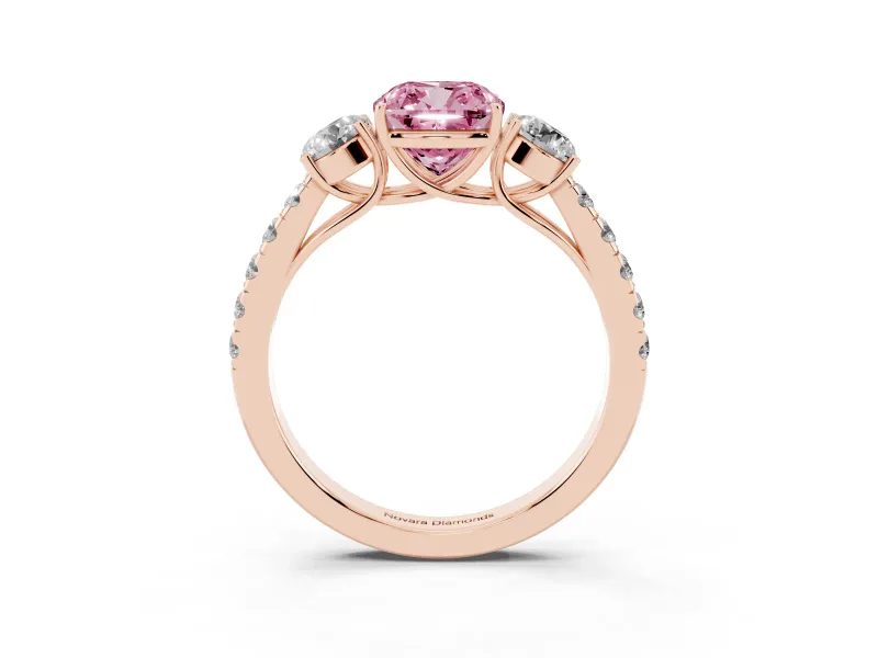 Fancy Pink Cushion Cut Diamond Three-Stone Ring Set in Rose gold with Round Side Stones and Delicate Pavé Band