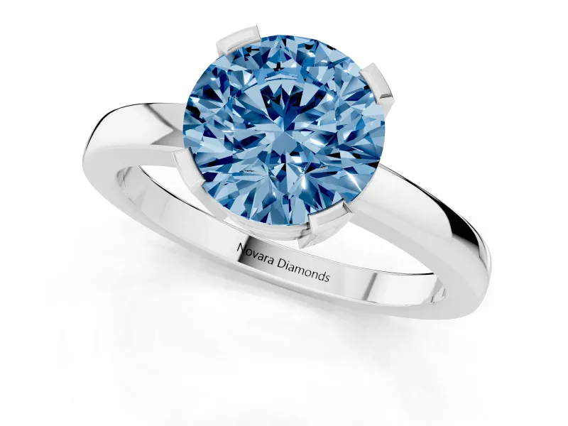 Fancy Blue Round Cut Diamond Solitaire Ring Set in Silver with Prong Head and Smooth Polished Band