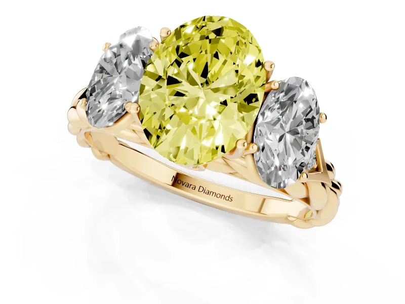 Fancy Yellow Oval Cut Diamond Three-Stone Ring Set in Yellow gold with Braided Band