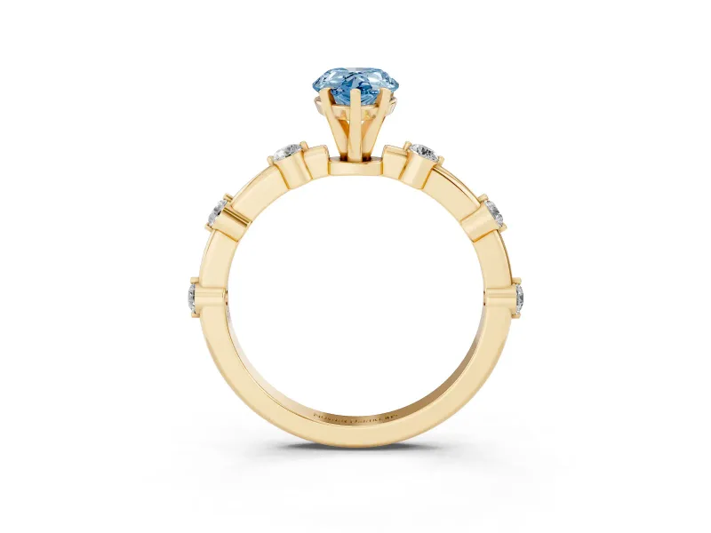Fancy Blue Pear Cut Diamond Solitaire Ring Set in Yellow gold with Bezel Set Side Stones and Prong Setting