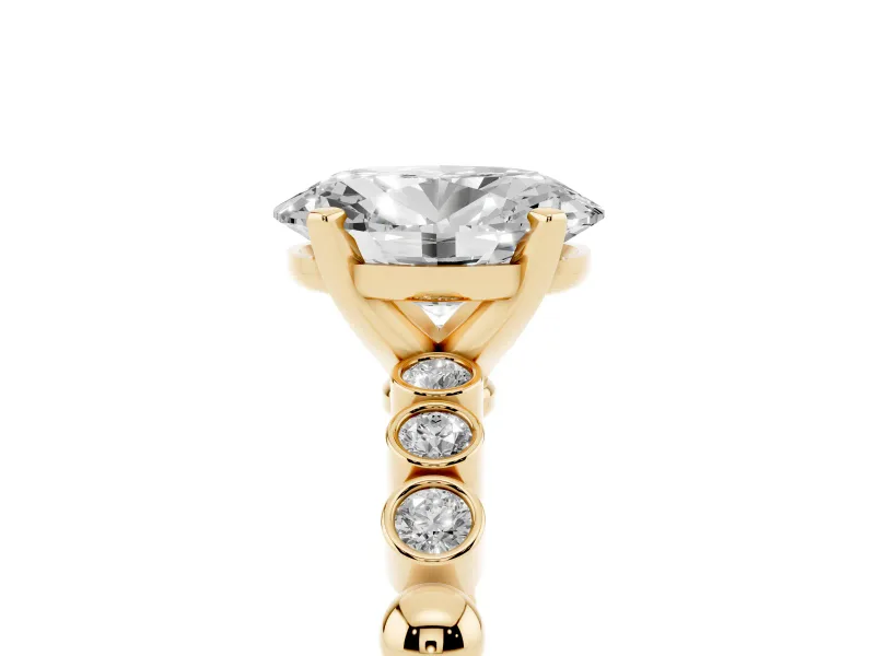 Oval Cut Diamond Solitaire Engagement Ring Set in Yellow gold with Bezel Accents on Beaded Band