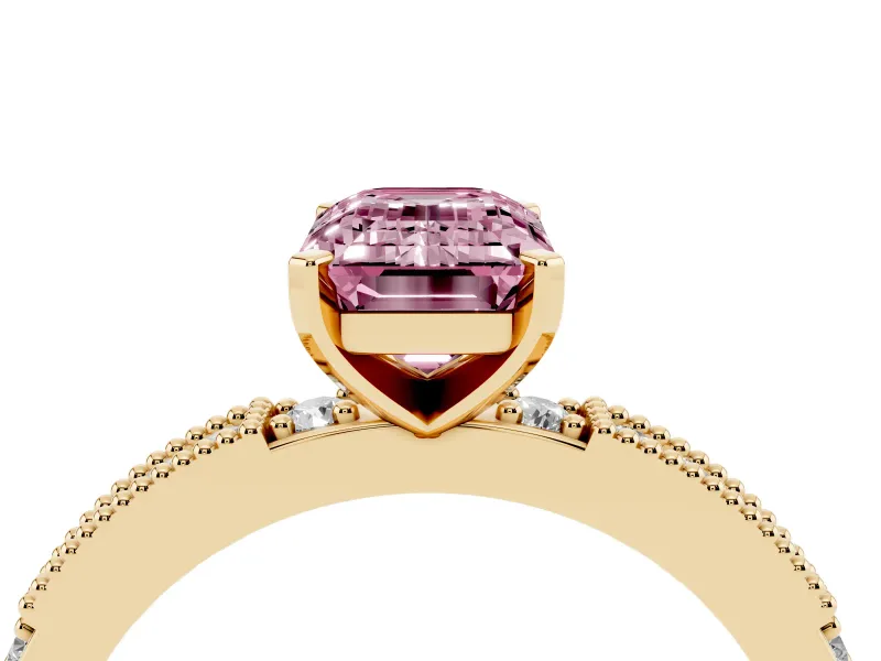 Fancy Pink Emerald Cut Diamond Solitaire Ring Set in Yellow gold with Slim Pavé Band and Prong Setting