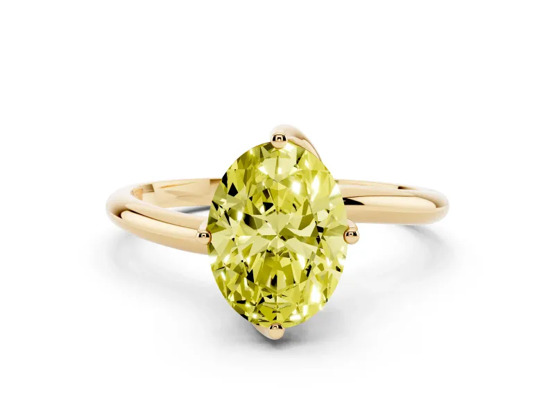 Fancy Yellow Oval Cut Diamond Solitaire Engagement Ring Set in Yellow gold with Classic Plain Band