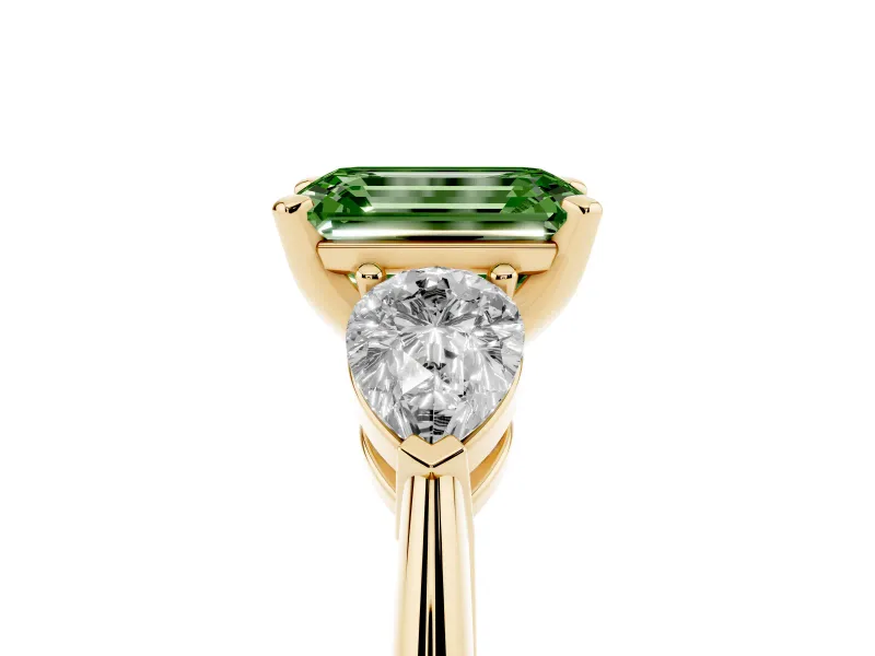 Fancy Green Three-Stone Emerald Cut Diamond Ring Set in Yellow gold with Pear Side Stones and Prong Setting