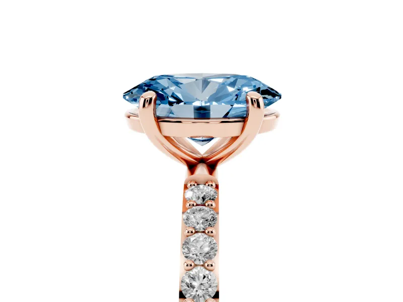 Fancy Blue Oval Cut Diamond Solitaire Ring Set in Rose gold with Round Pavé Band and Prong Setting