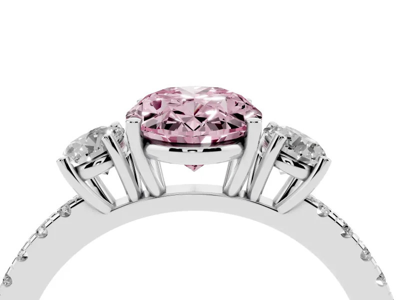 Fancy Pink Oval Cut Diamond Three-Stone Ring Set in Platinum with Pavé Band and Graduated Sides