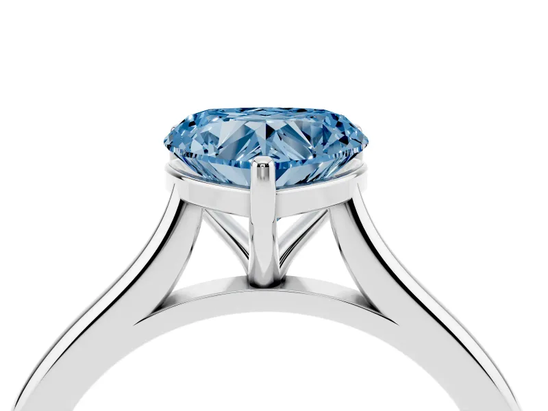 Fancy Blue Heart Cut Diamond Solitaire Ring Set in White gold with Cathedral Band and Prong Setting