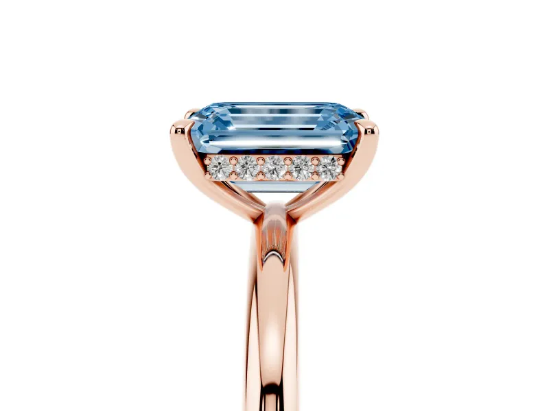 Fancy Blue Emerald Cut Diamond Solitaire Ring Set in Rose gold with Thin Band and Prong Setting