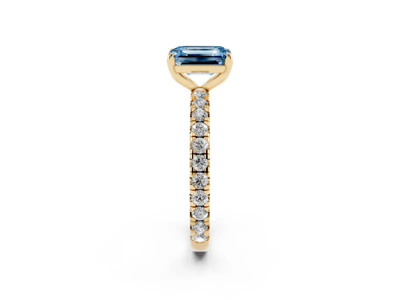 Fancy Blue Emerald Cut Diamond Pavé Solitaire Ring Set in Yellow gold with Round Band and Prong Setting